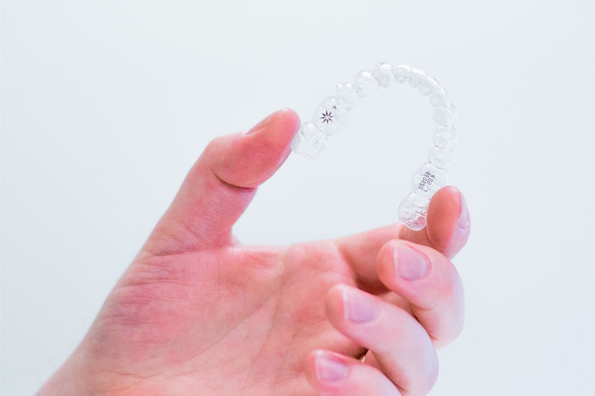 Great Neck Invisalign consultation—patient reviewing clear-aligner treatment plan at our Bayside office.